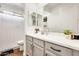Bathroom with a light gray vanity and framed mirrors at 24441 N 142Nd Dr, Surprise, AZ 85387