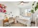 Bedroom with a ceiling fan, desk, decor, and a window with blinds at 24441 N 142Nd Dr, Surprise, AZ 85387