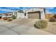 Inviting single-story home featuring a neutral color palette, well-kept landscape, and a two-car garage at 24441 N 142Nd Dr, Surprise, AZ 85387