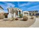Inviting single-story home featuring a neutral color palette, well-kept landscape, and a two-car garage at 24441 N 142Nd Dr, Surprise, AZ 85387