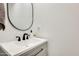 Stylish powder room with modern sink, fixtures, and mirror provide a sleek and functional space at 24441 N 142Nd Dr, Surprise, AZ 85387