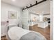 Room featuring a treatment bed with sliding doors to the kitchen with an island and appliances at 24441 N 142Nd Dr, Surprise, AZ 85387