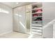 Walk-in closet featuring closet system with mirror and drawers at 24617 N 49Th Ave, Glendale, AZ 85310