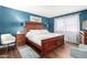 Bright primary bedroom with wood floors, large windows, and a coordinating rug at 25261 S Berry Brook Dr, Sun Lakes, AZ 85248