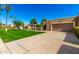 Single Gathering home featuring a well-maintained lawn and desert landscaping at 25261 S Berry Brook Dr, Sun Lakes, AZ 85248