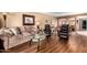 Comfortable living room with plush seating, stylish decor, and hardwood floors at 25261 S Berry Brook Dr, Sun Lakes, AZ 85248