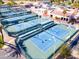 Clean aerial view of well-maintained tennis courts in an active community at 25261 S Berry Brook Dr, Sun Lakes, AZ 85248