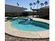 Beautiful pool with cool blue water, sun umbrella and desert landscaping at 26245 S Glenburn Dr, Sun Lakes, AZ 85248