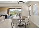 Stylish dining area adjacent to an open-air patio showcases natural light and scenic views for comfortable living at 27000 N Alma School Pkwy # 1024, Scottsdale, AZ 85262