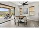 Bright dining room with a modern table, chairs, and seamless access to a covered patio offering stunning desert views at 27000 N Alma School Pkwy # 1024, Scottsdale, AZ 85262