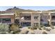 Spacious home with balcony and covered patio, surrounded by desert landscaping and mountain views at 27000 N Alma School Pkwy # 1024, Scottsdale, AZ 85262