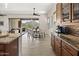 Gourmet kitchen with stainless steel appliances and granite counters plus an adjacent dining area and mountain views at 27000 N Alma School Pkwy # 1024, Scottsdale, AZ 85262