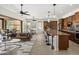 Open-concept living space featuring a modern kitchen, dining area, and comfortable seating with neutral color palette at 27000 N Alma School Pkwy # 1024, Scottsdale, AZ 85262