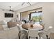 Open concept living room showcasing the living room, dining room, and seamless access to outdoor space at 27000 N Alma School Pkwy # 1024, Scottsdale, AZ 85262