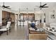 Spacious open-concept living area with a large kitchen island, modern decor, and inviting seating arrangement at 27000 N Alma School Pkwy # 1024, Scottsdale, AZ 85262