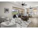 Cozy living room flows to outdoor patio with expansive views, adjacent to dining area with ample natural light at 27000 N Alma School Pkwy # 1024, Scottsdale, AZ 85262