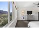 Bright main bedroom with natural light and views of the surrounding desert landscape at 27000 N Alma School Pkwy # 1024, Scottsdale, AZ 85262