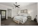 Relaxing main bedroom with a ceiling fan and neutral decor creates a peaceful retreat at 27000 N Alma School Pkwy # 1024, Scottsdale, AZ 85262