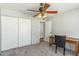 Bedroom with ceiling fan, carpet, closet and a window providing natural light at 2920 E Villa Maria Dr, Phoenix, AZ 85032