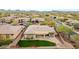 Aerial view showing home's backyard, landscaping, and neighborhood features, including the golf course at 3138 W Ravina Ln, Anthem, AZ 85086