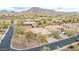 Beautiful homes in the community with lush landscaping, golf course, and scenic mountain backdrop at 3138 W Ravina Ln, Anthem, AZ 85086