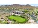 Expansive aerial view featuring golf course, clubhouse, and meticulously planned luxury community at 3138 W Ravina Ln, Anthem, AZ 85086