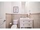 Neutral half bathroom with marble vanity, framed art, and decorative accessories at 3138 W Ravina Ln, Anthem, AZ 85086