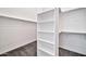 Walk-in closet features shelving and rods for ample storage space at 3138 W Ravina Ln, Anthem, AZ 85086