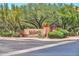 Beautiful stone community sign surrounded by lush desert landscaping and mature trees at 3138 W Ravina Ln, Anthem, AZ 85086