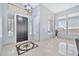 Bright foyer featuring decorative tile inlay, high ceilings, large windows, and stylish modern lighting at 3138 W Ravina Ln, Anthem, AZ 85086