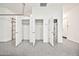 Garage interior featuring multiple storage closets and a water heater at 3138 W Ravina Ln, Anthem, AZ 85086
