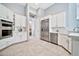 Bright kitchen with white cabinetry, stainless steel appliances, and tiled flooring at 3138 W Ravina Ln, Anthem, AZ 85086