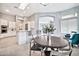 Eat-in kitchen with a breakfast bar, stainless steel appliances, and a view of the living space at 3138 W Ravina Ln, Anthem, AZ 85086