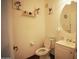 Compact bathroom featuring a toilet and sink with a cabinet, ideal for functionality and efficient space usage at 3150 E Beardsley Rd # 1105, Phoenix, AZ 85050