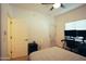 A bedroom with a queen-size bed, a desk, and a ceiling fan at 3150 E Beardsley Rd # 1105, Phoenix, AZ 85050