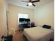 Bedroom featuring desk and chair set up with carpet, bed, and natural lighting at 3150 E Beardsley Rd # 1105, Phoenix, AZ 85050