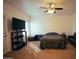 Spacious bedroom with a ceiling fan, window, and a couch for comfortable seating or relaxing at 3150 E Beardsley Rd # 1105, Phoenix, AZ 85050