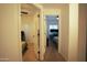 Hallway connecting two bedrooms with a ceiling fan and windows at 3150 E Beardsley Rd # 1105, Phoenix, AZ 85050
