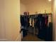 Spacious walk-in closet with ample hanging space and shelving for organized storage solutions at 3150 E Beardsley Rd # 1105, Phoenix, AZ 85050