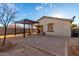 Desert backyard with pergola, string lights, and gravel at 35751 N Bandolier Dr, San Tan Valley, AZ 85144