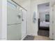 Bathroom with a glass-enclosed shower and a view into the bedroom at 35751 N Bandolier Dr, San Tan Valley, AZ 85144