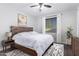 Serene bedroom boasts natural light, neutral walls, and simple furnishings at 35751 N Bandolier Dr, San Tan Valley, AZ 85144