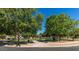 Scenic community park with playground, picnic areas, and lush green spaces at 35751 N Bandolier Dr, San Tan Valley, AZ 85144