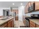 Well-equipped kitchen features stainless steel appliances, granite countertops, and ample cabinet space at 35751 N Bandolier Dr, San Tan Valley, AZ 85144