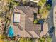 An aerial view of a home, showcasing the roof, pool and surrounding landscaping at 37170 N Granite Creek Ln, Carefree, AZ 85377