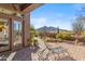 Outdoor living with a cozy patio and desert-themed landscape, ideal for relaxing and enjoying the natural beauty at 37170 N Granite Creek Ln, Carefree, AZ 85377