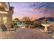 This beautiful backyard has a peaceful fountain, desert landscaping, and a mountain view at 37170 N Granite Creek Ln, Carefree, AZ 85377