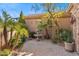 Beautiful courtyard with a fountain, lush landscaping, a private brick patio, and a charming architecture at 37170 N Granite Creek Ln, Carefree, AZ 85377