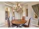 Formal dining area featuring a wood table set under an ornate chandelier at 37170 N Granite Creek Ln, Carefree, AZ 85377