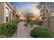 Expansive desert home featuring a stone pathway amidst lush desert landscaping at 37170 N Granite Creek Ln, Carefree, AZ 85377